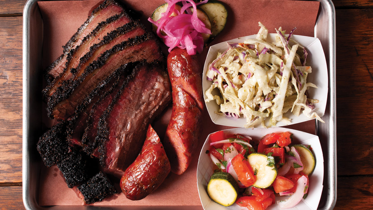 Interstellar BBQ signature dishes Smoked Brisket, Pork Belly, Glazed Pork Shoulder, Chimichurri Short Rib, and Jalapeño Popper Sausage.
